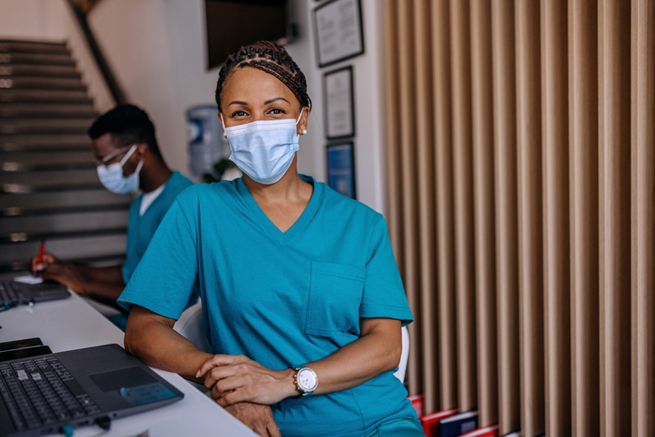 nurse smiling under a mask